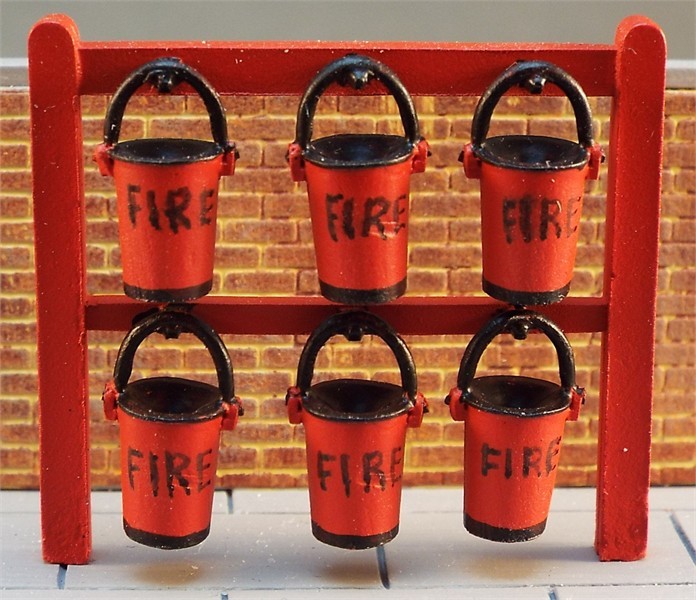 6 tall fire buckets on free-standing rack